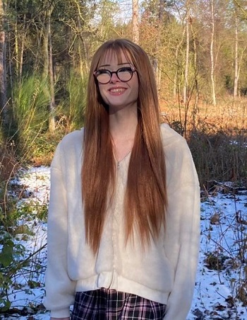 Photo of Brianna Ghey, taken on a sunny day in woodland, with snow on the ground around her
