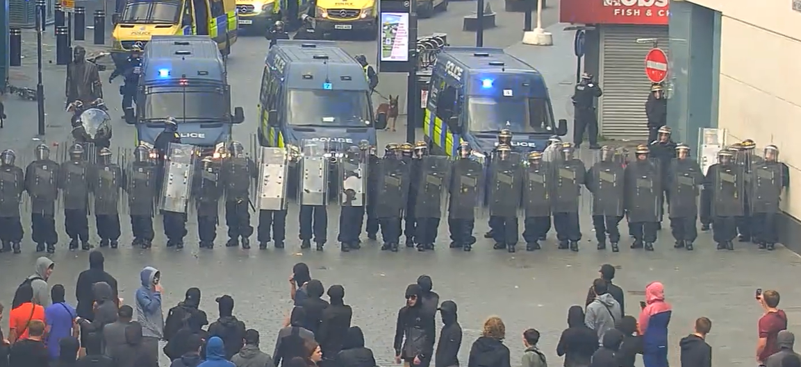 police face protestors in Liverpool city centre